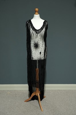 Lot 1517 - A 1920's "Flapper" jet-beaded and star-burst sequin evening dress