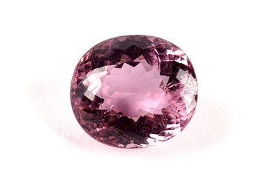 Lot 306 - A loose oval mixed cut pink tourmaline