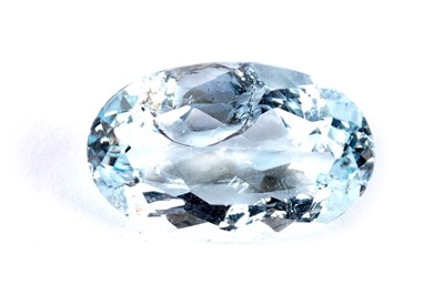 Lot 303 - A loose oval mixed cut aquamarine