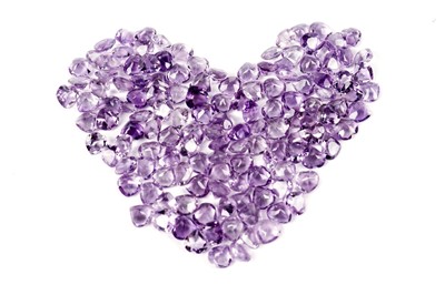 Lot 304 - A collection of loose heart-shaped amethysts