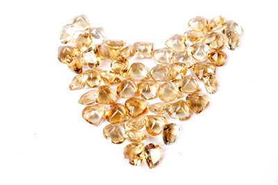 Lot 312 - A collection of loose heart-shaped citrines