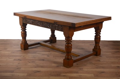 Lot 71 - A Titchmarsh & Goodwin carved oak draw leaf refectory style dining table