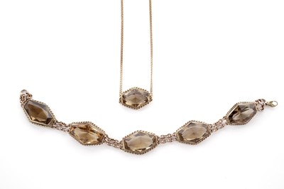 Lot 126 - A smoky quartz necklet and bracelet