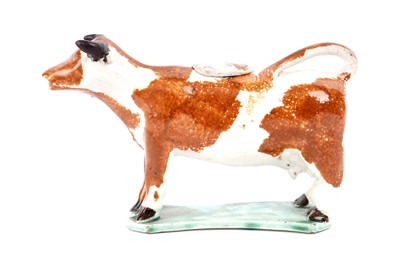 Lot 930 - An early 19th Century pearlware cow creamer