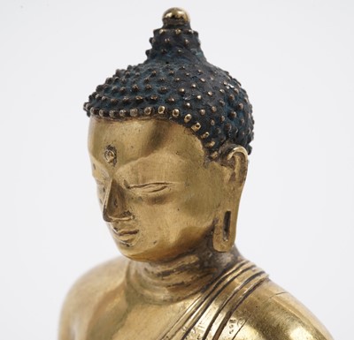 Lot 885 - A Sino-Tibetan gilt bronze figure Shakyamuni