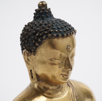 Lot 885 - A Sino-Tibetan gilt bronze figure Shakyamuni