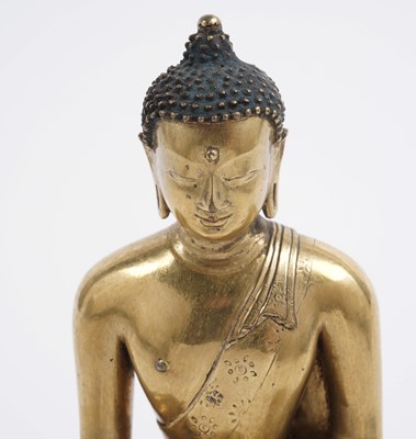 Lot 885 - A Sino-Tibetan gilt bronze figure Shakyamuni