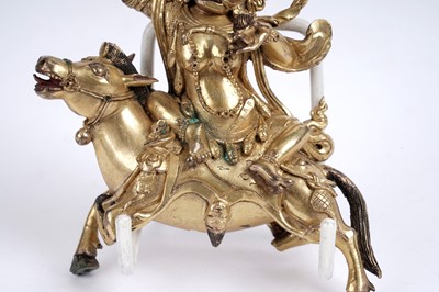 Lot 886 - A Sino-Tibetan gilt bronze figure of the Goddess Palden Lhamo