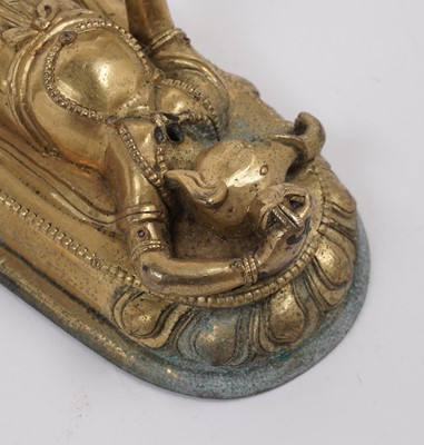 Lot 887 - A Tibetan gilt bronze figure of Ganapati