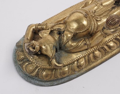 Lot 887 - A Tibetan gilt bronze figure of Ganapati