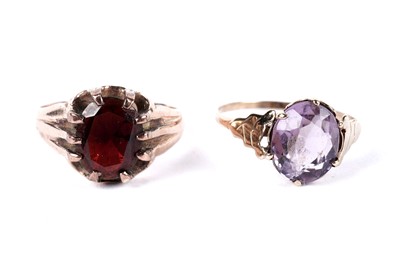 Lot 236 - A garnet single stone ring; and an amethyst ring