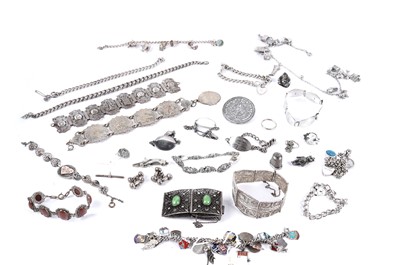 Lot 252 - A collection of silver charm bracelets; and other jewellery