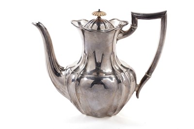 Lot 397 - A George V silver teapot