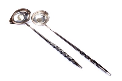 Lot 403 - Two Georgian silver toddy ladles