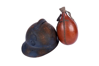 Lot 188 - A WWI French Infantry Adrian helmet and gourd water bottle