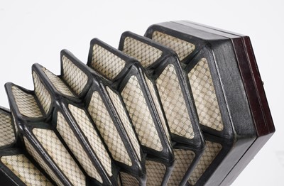 Lot 4 - An un-marked 27 button concertina with fitted mahogany case