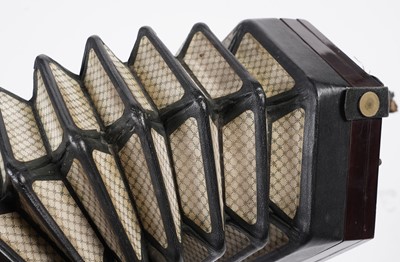 Lot 4 - An un-marked 27 button concertina with fitted mahogany case