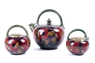 Lot 925 - A William Moorcroft three-piece tea set