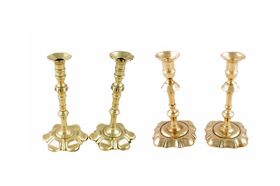 Lot 401 - Two pairs of antique brass candlesticks