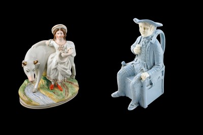 Lot 29 - A Victorian Staffordshire cow and dairy maid; and a Victorian Toby Jug