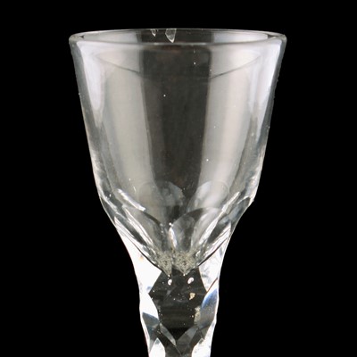 Lot 70 - Two George III wine glasses with facetted stems