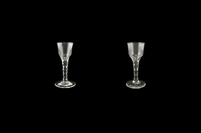 Lot 70 - Two George III wine glasses with facetted stems