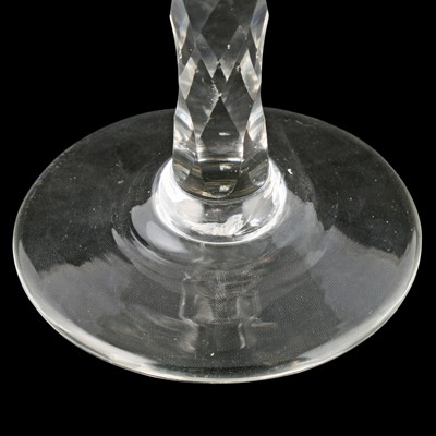 Lot 70 - Two George III wine glasses with facetted stems