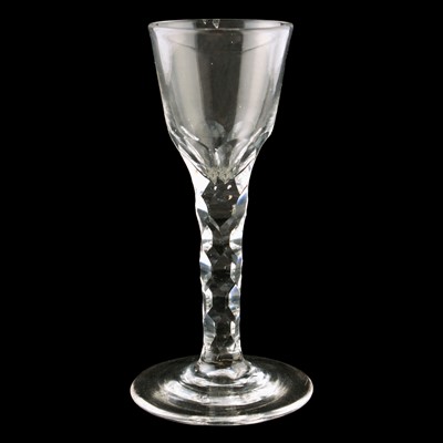 Lot 70 - Two George III wine glasses with facetted stems