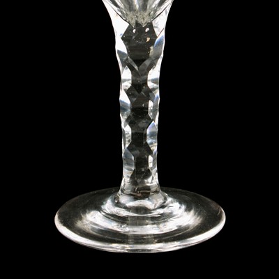 Lot 70 - Two George III wine glasses with facetted stems