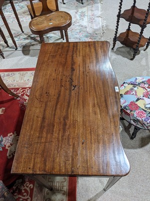 Lot 473 - A fine George III mahogany serpentine side table in the Hepplewhite style