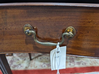 Lot 473 - A fine George III mahogany serpentine side table in the Hepplewhite style