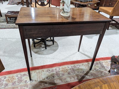Lot 473 - A fine George III mahogany serpentine side table in the Hepplewhite style