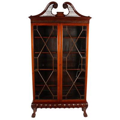 Lot 498 - An Irish mahogany Chippendale style cabinet bookcase