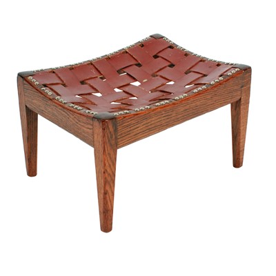 Lot 515 - A George V oak and leather stool by Arthur Simpson of Kendal