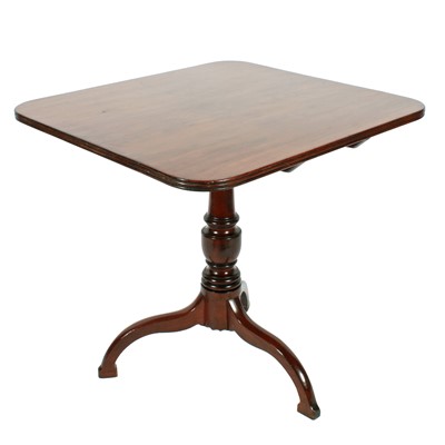 Lot 539 - A late Georgian mahogany tilt action tripod supper table