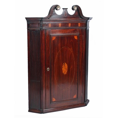 Lot 547 - A George III inlaid mahogany corner cupboard