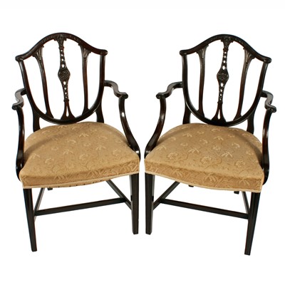 Lot 568 - A pair of Edwardian mahogany elbow chairs in a Georgian Hepplewhite design