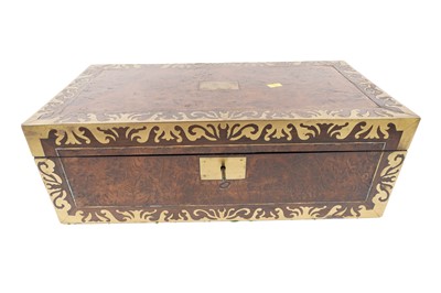 Lot 429 - A Victorian amboyna and brass bound table writing box