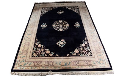 Lot 255 - A Chinese embossed carpet