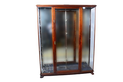 Lot 630 - An early 20th Century walnut shop display cabinet