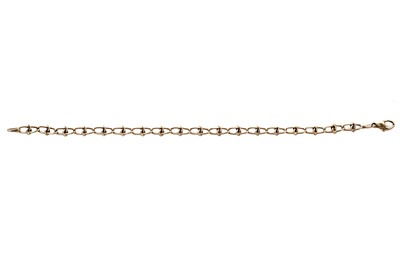 Lot 28 - A bi-colour yellow and white gold fancy link chain bracelet