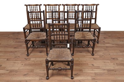 Lot 2 - An Oak drop leaf extending dining table; and a matched set of eight chairs