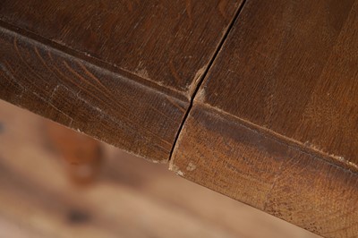 Lot 2 - An Oak drop leaf extending dining table; and a matched set of eight chairs