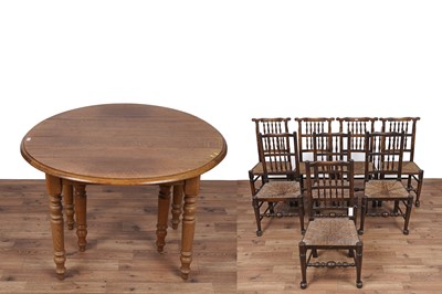 Lot 2 - An Oak drop leaf extending dining table; and a matched set of eight chairs