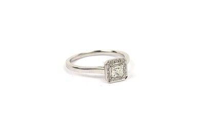 Lot 668 - A princess cut diamond cluster ring