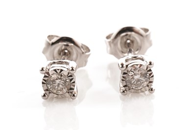 Lot 137 - A pair of diamond stud earrings