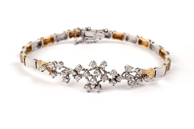 Lot 701 - An 18ct yellow and white gold diamond bracelet