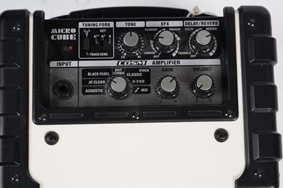 Lot 250 - A Roland Micro Cube practice guitar amplifier