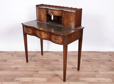 Lot 115 - Reprodux by Bevan Funnell: a mahogany serpentine fronted writing desk