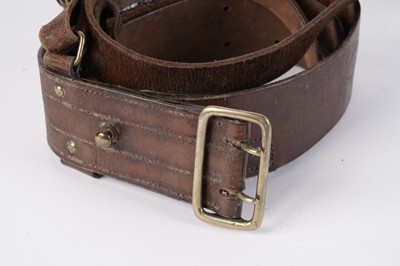 Lot 115 - A collection of ‘Sam Browne’ belts; and two Pipers black plastic Baldricks